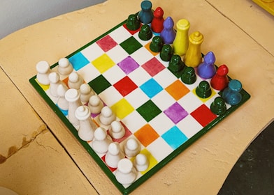 A cake shaped like a chess board on a table