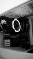 A close up of a computer case with a fan