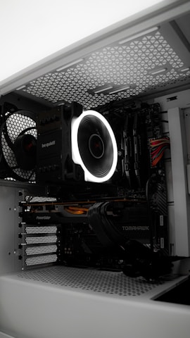 A close up of a computer case with a fan