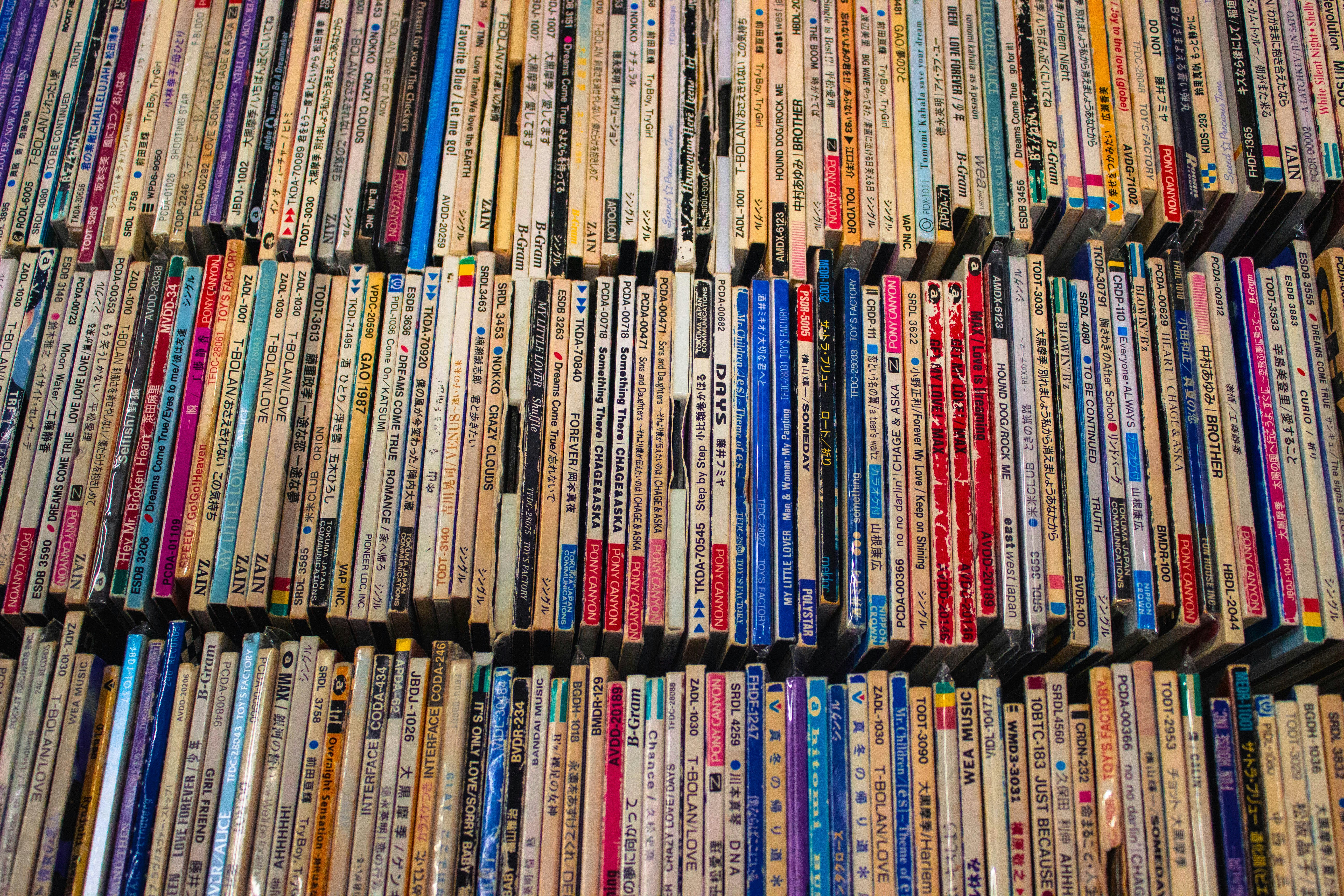 A large amount of cds are stacked on top of each other