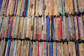 A large amount of cds are stacked on top of each other