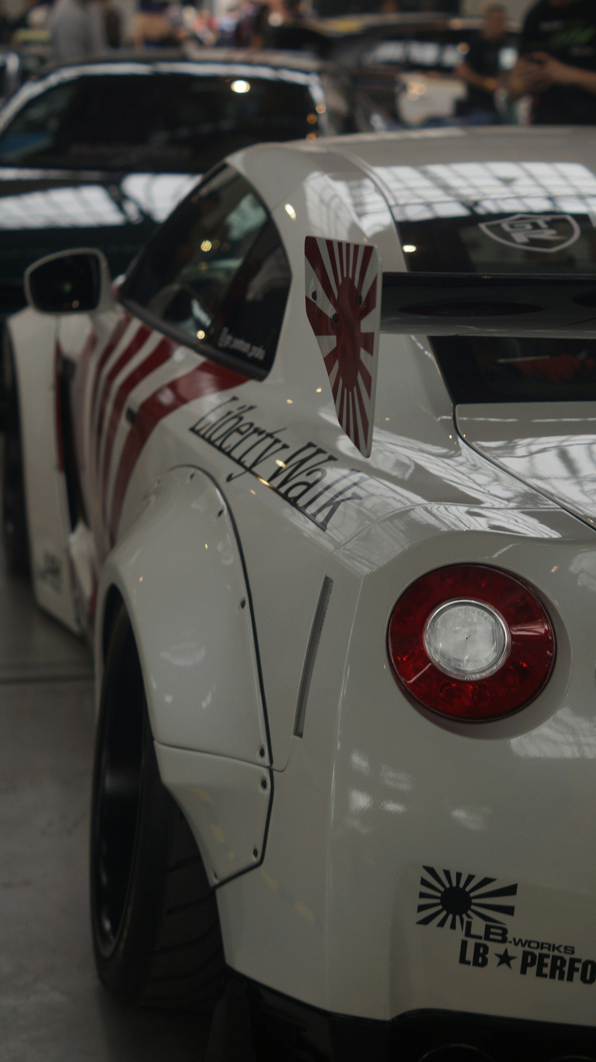 A white sports car parked in a garage