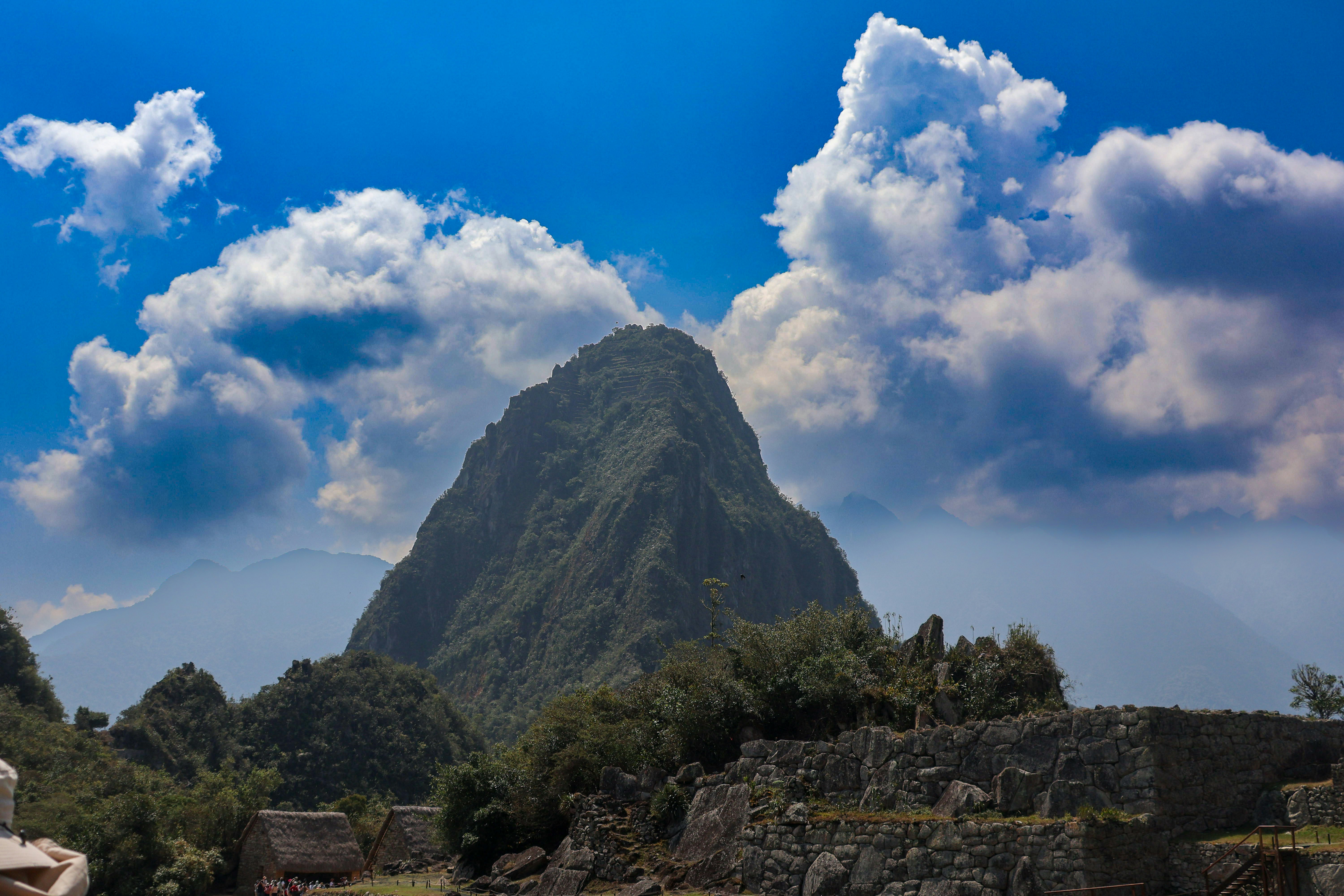 A boat in the water with a mountain in the background