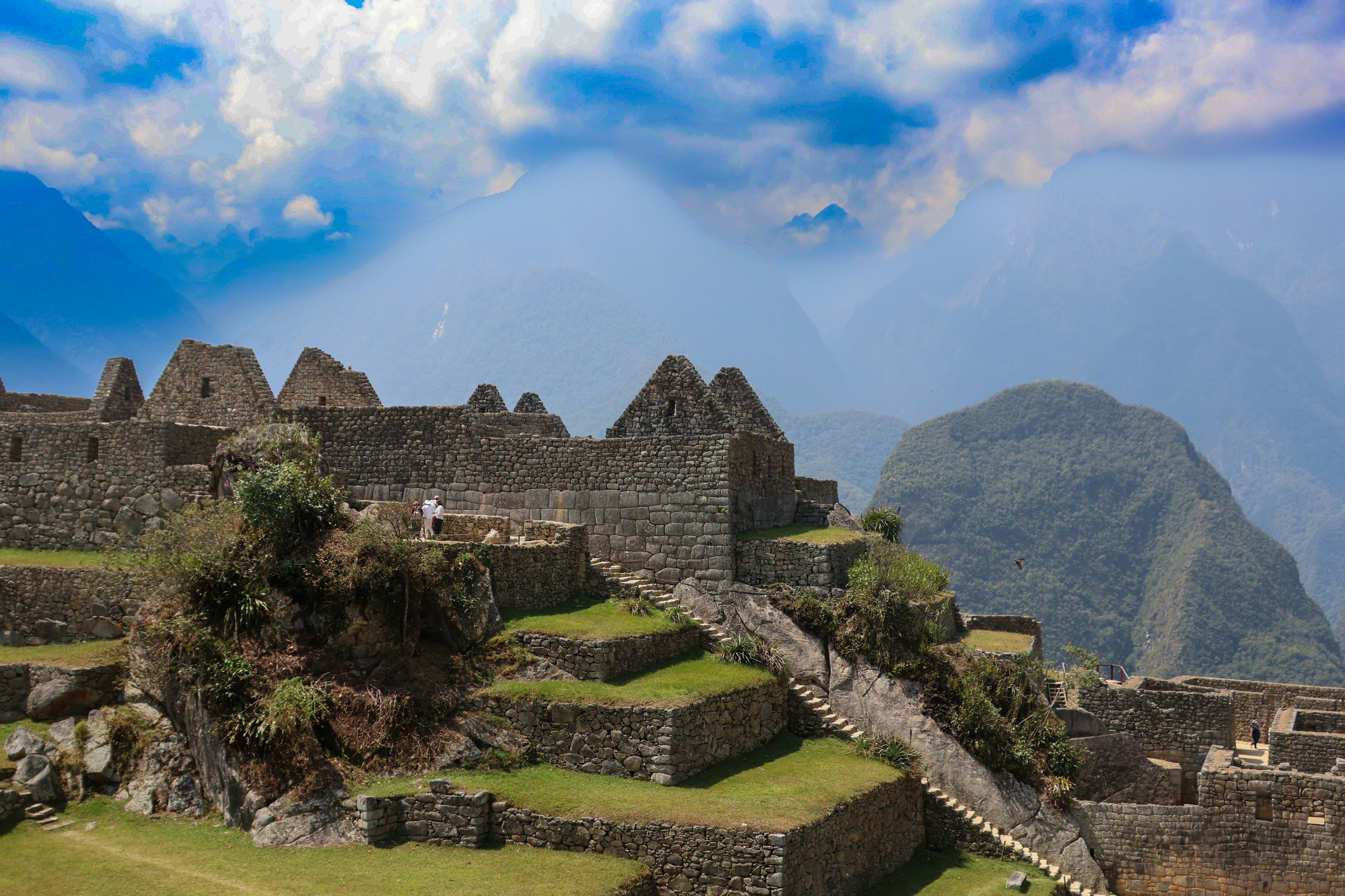 A view of the ruins of a city with a mountain in the background