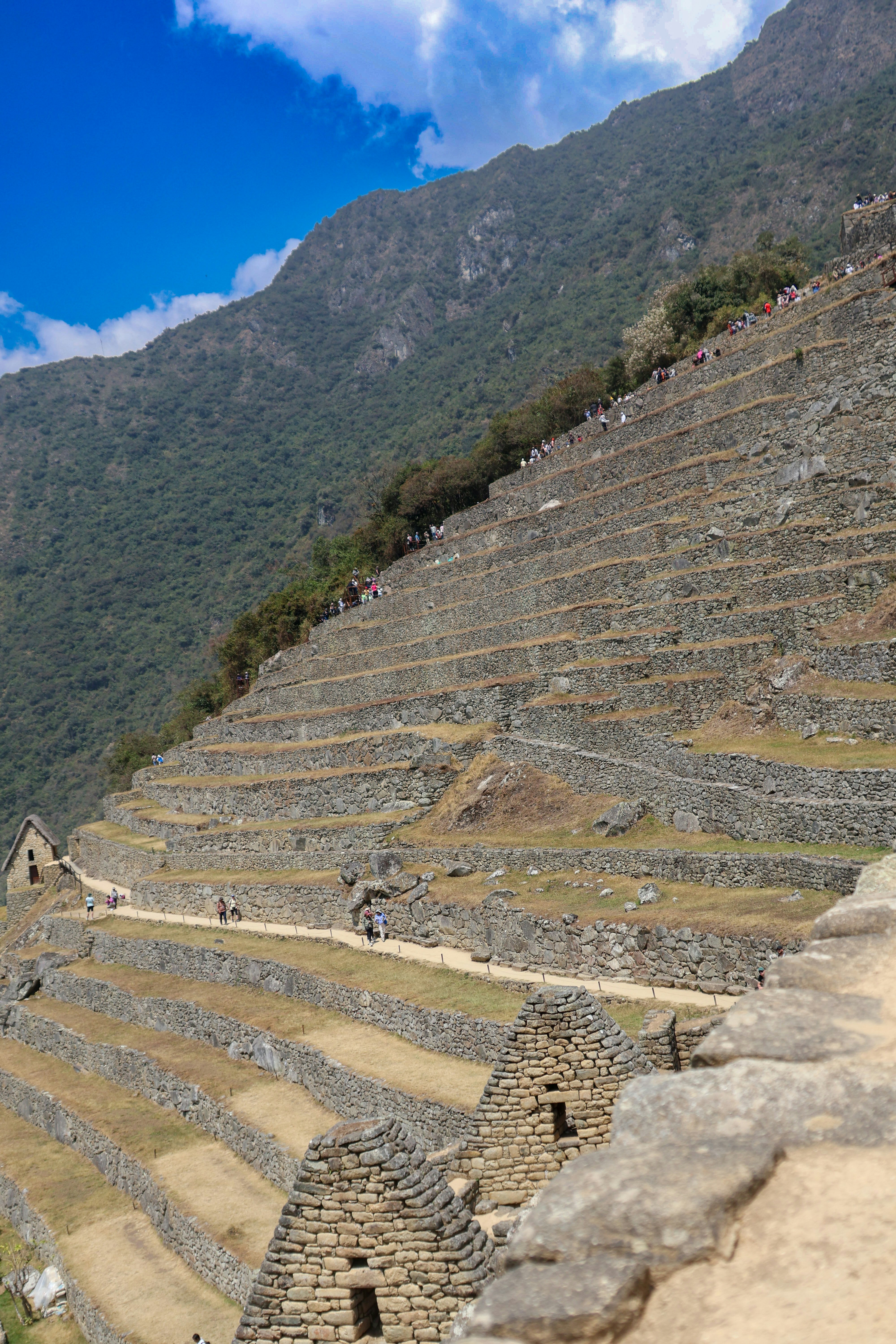 A view of a stone structure with a mountain in the background