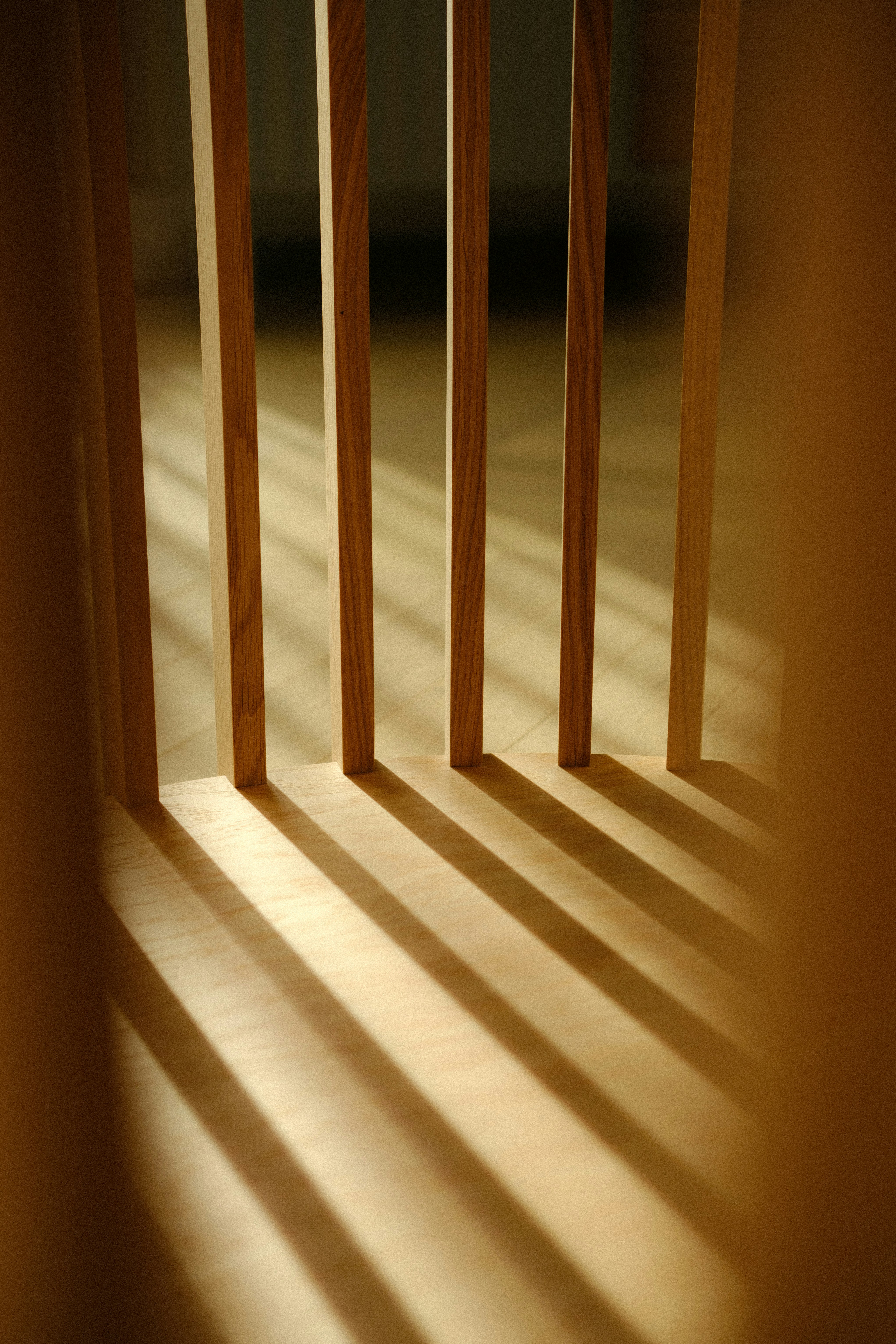 A room with a wooden floor and a window
