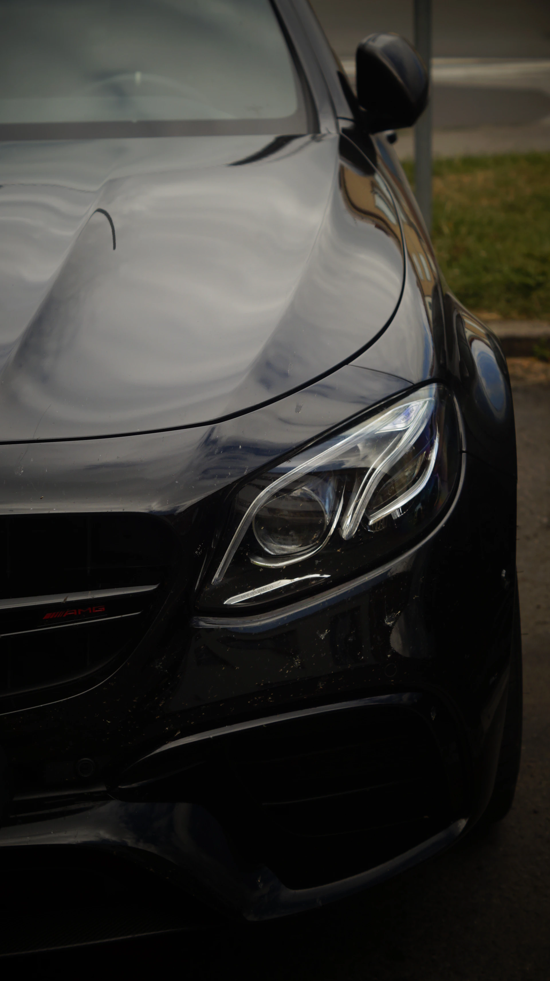 A close up of a car parked on the side of the road