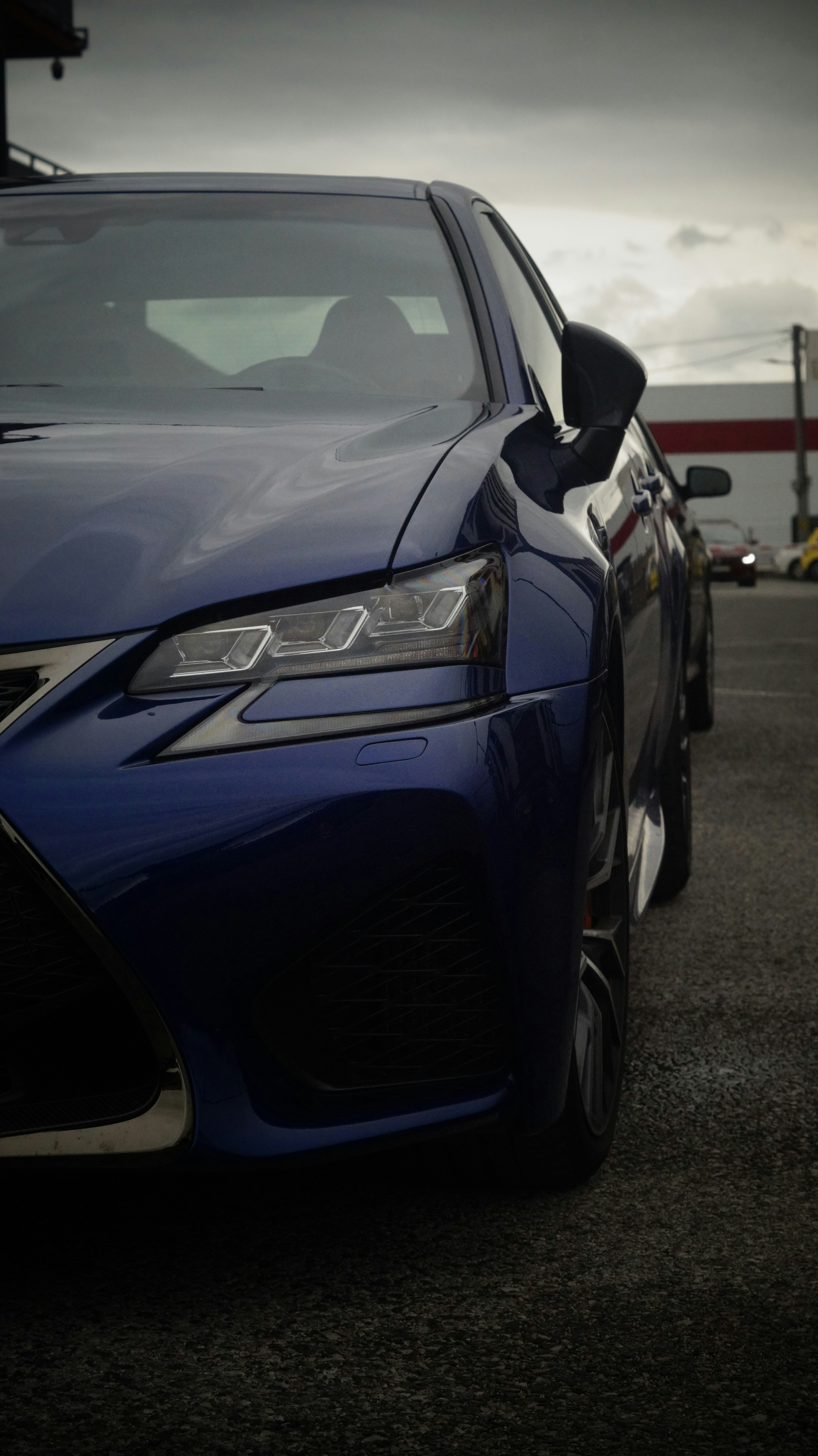 A blue car parked in a parking lot