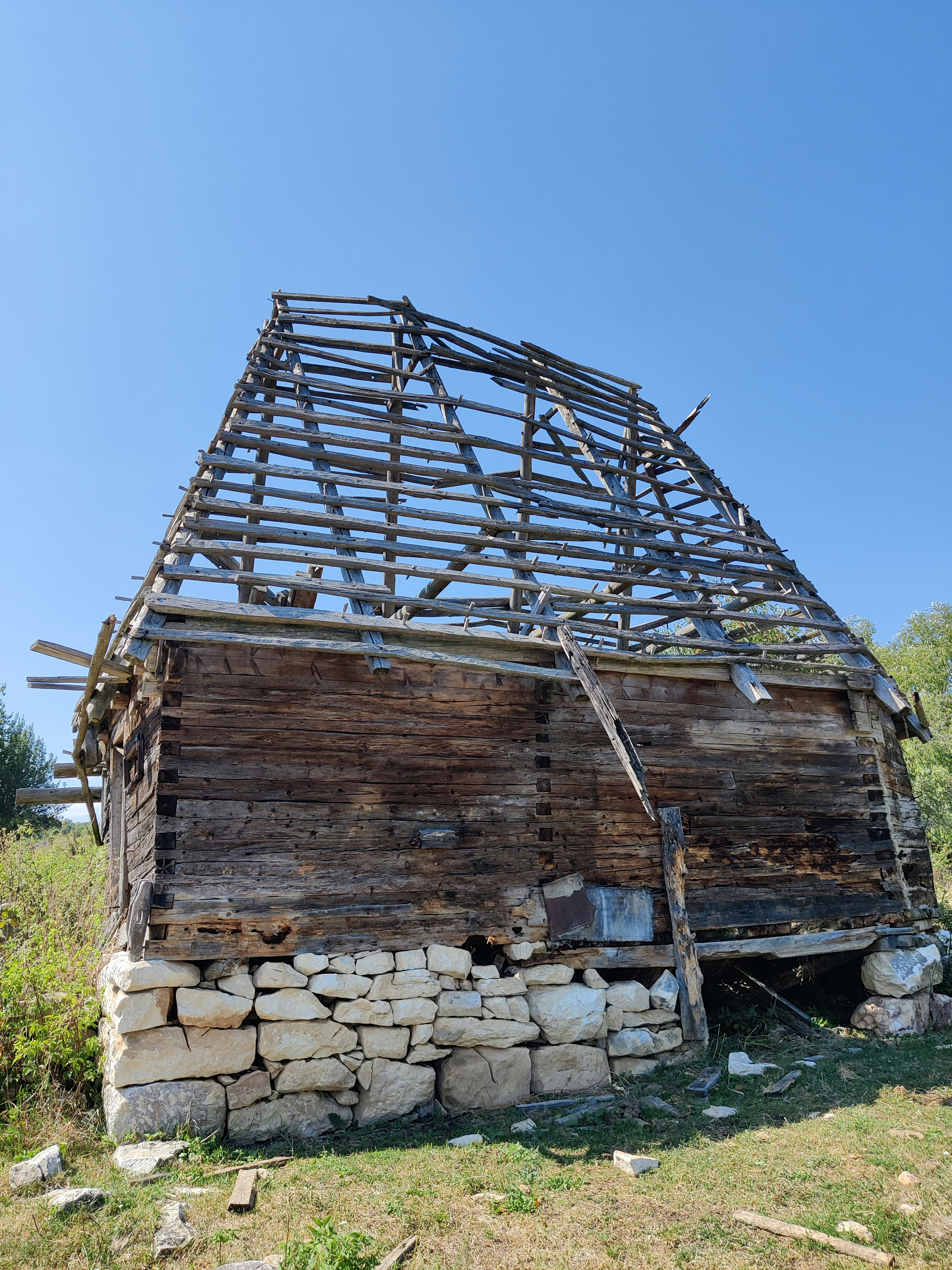 An old wooden barn with a metal roof