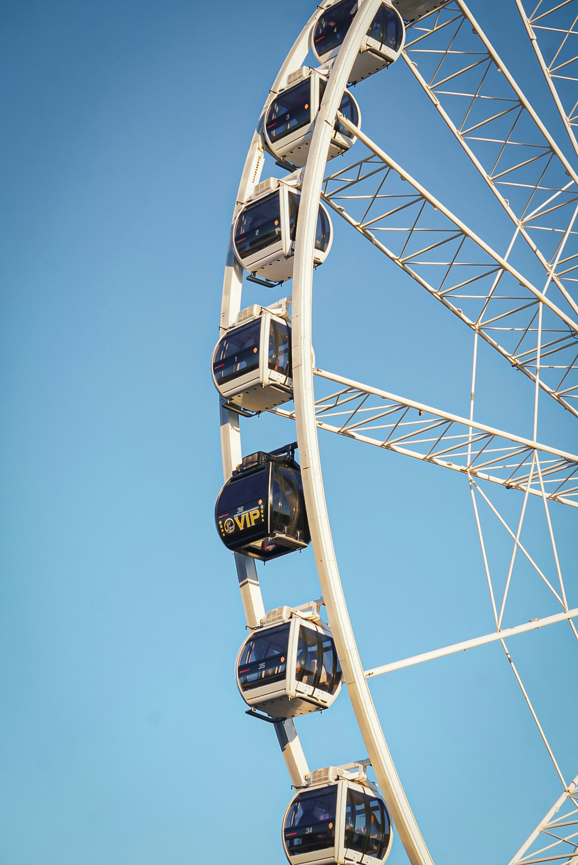 A ferris wheel with a blue sky in the background