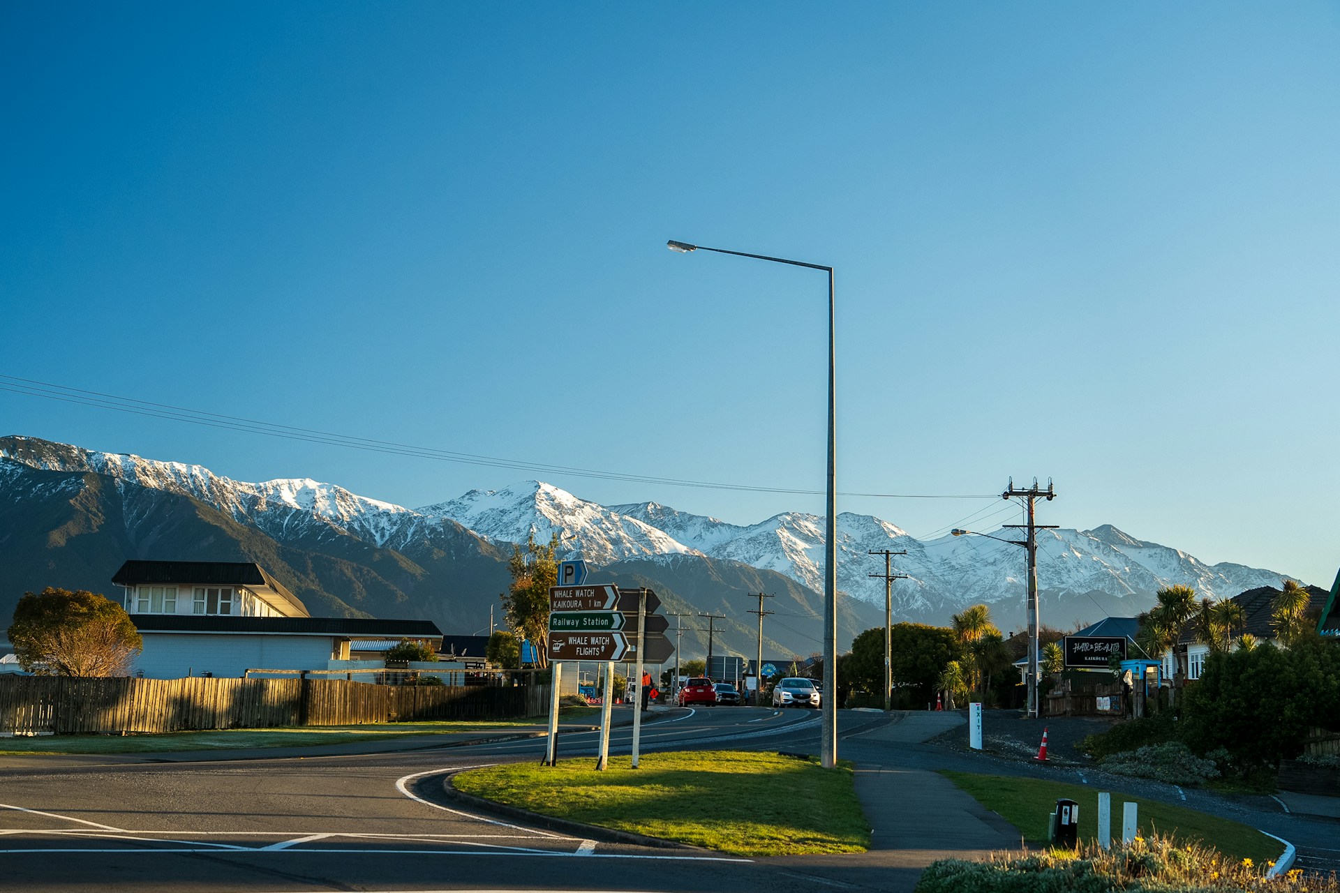 A view of a street with mountains in the background