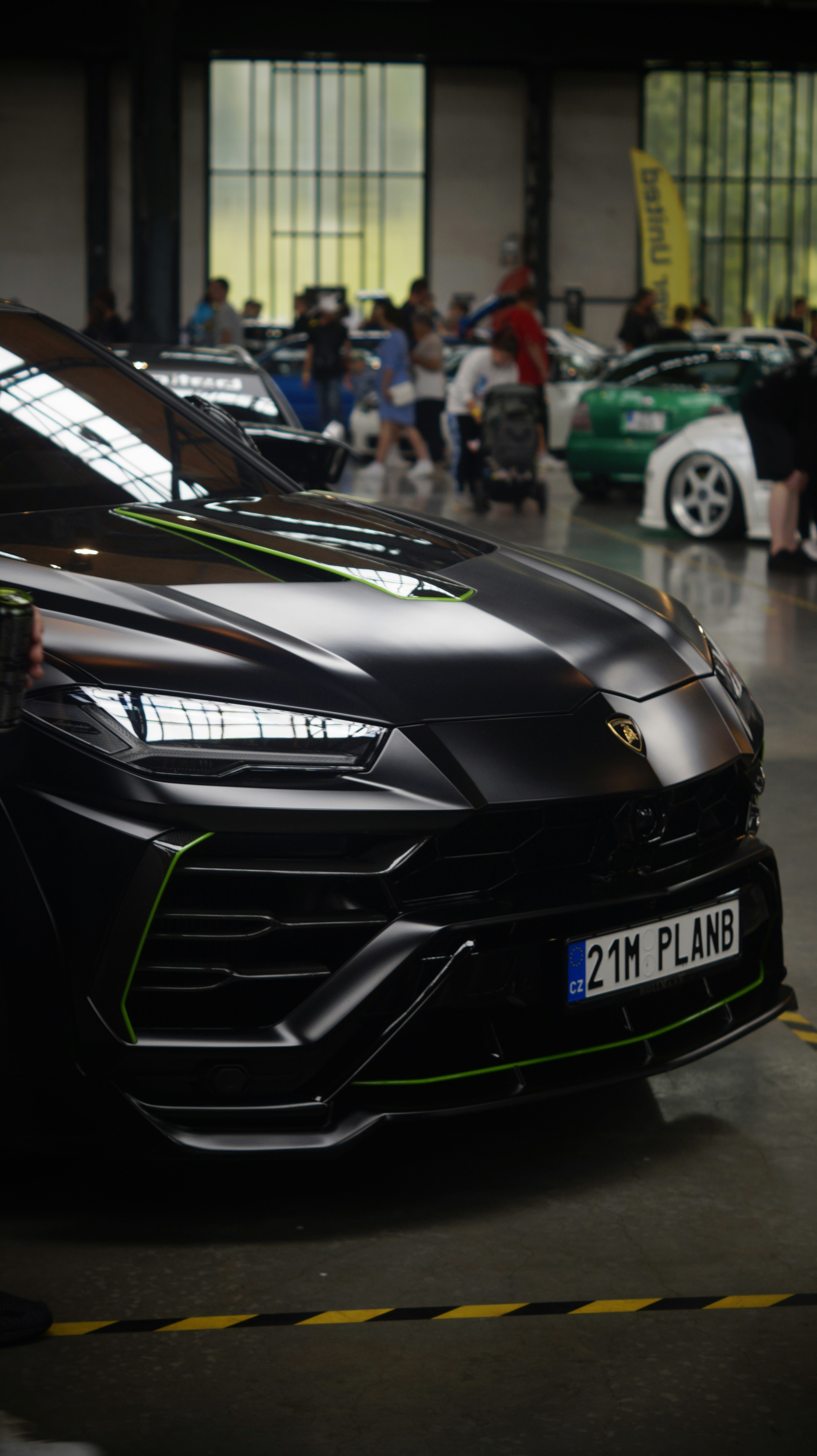 A black sports car parked in a garage