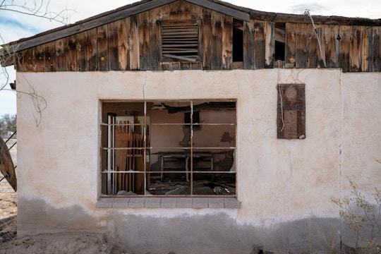 A run down house with a broken window