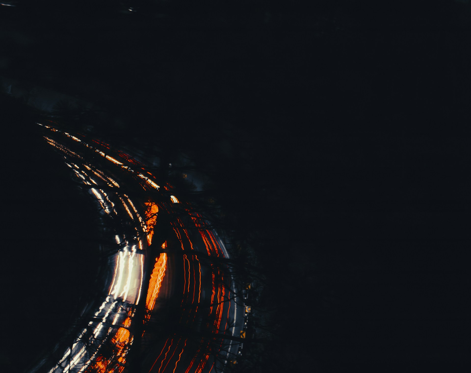 A blurry photo of a street at night