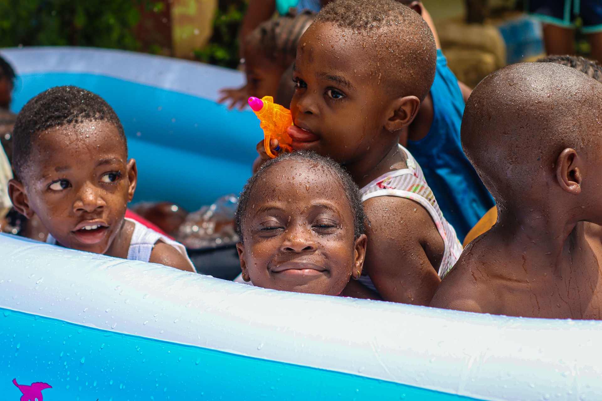 A group of children in an inflatable pool