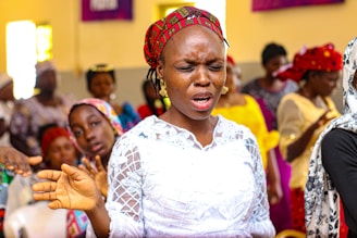 A woman standing in front of a group of people