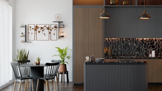 A kitchen and dining room with a table and chairs