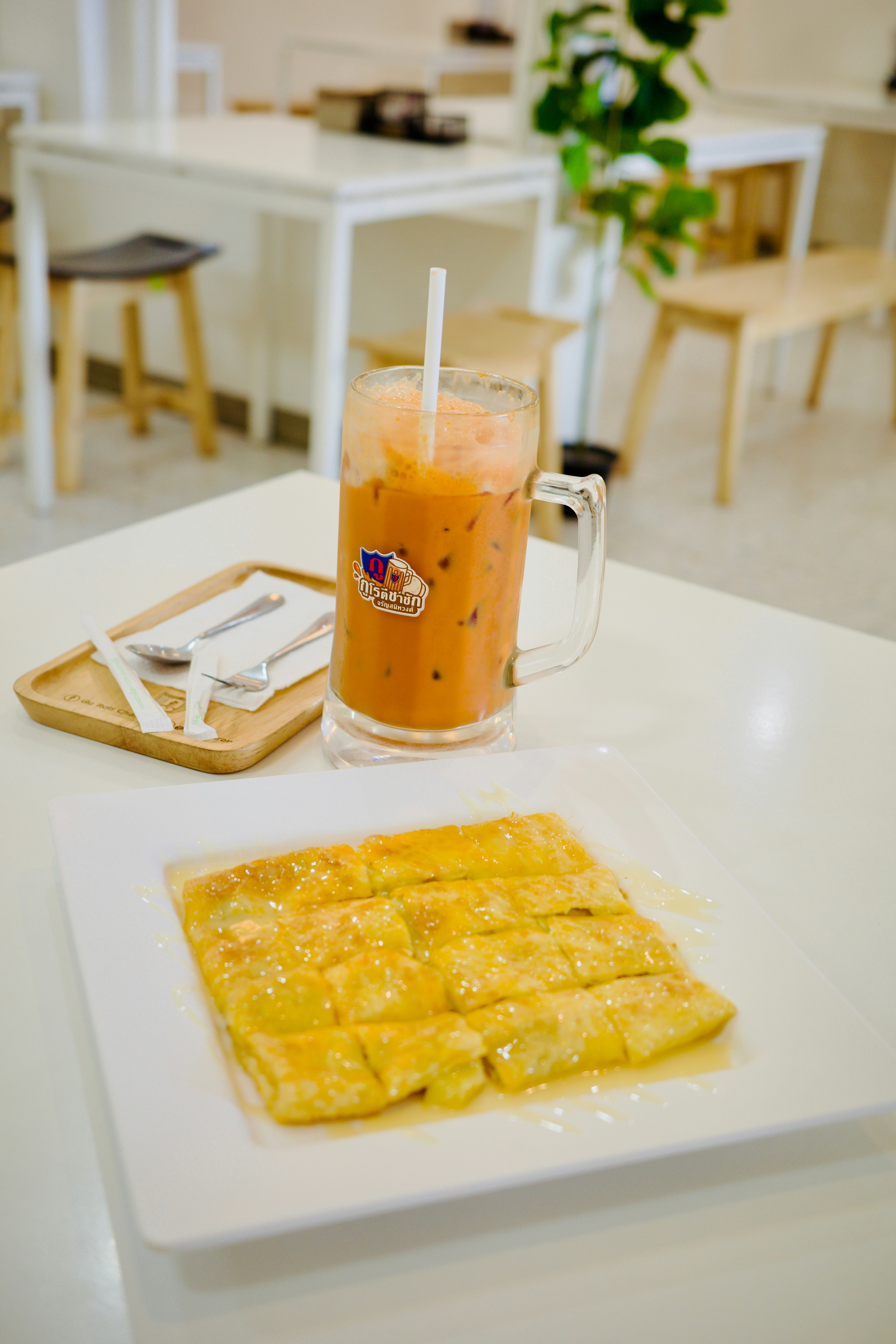 A plate of food and a drink on a table
