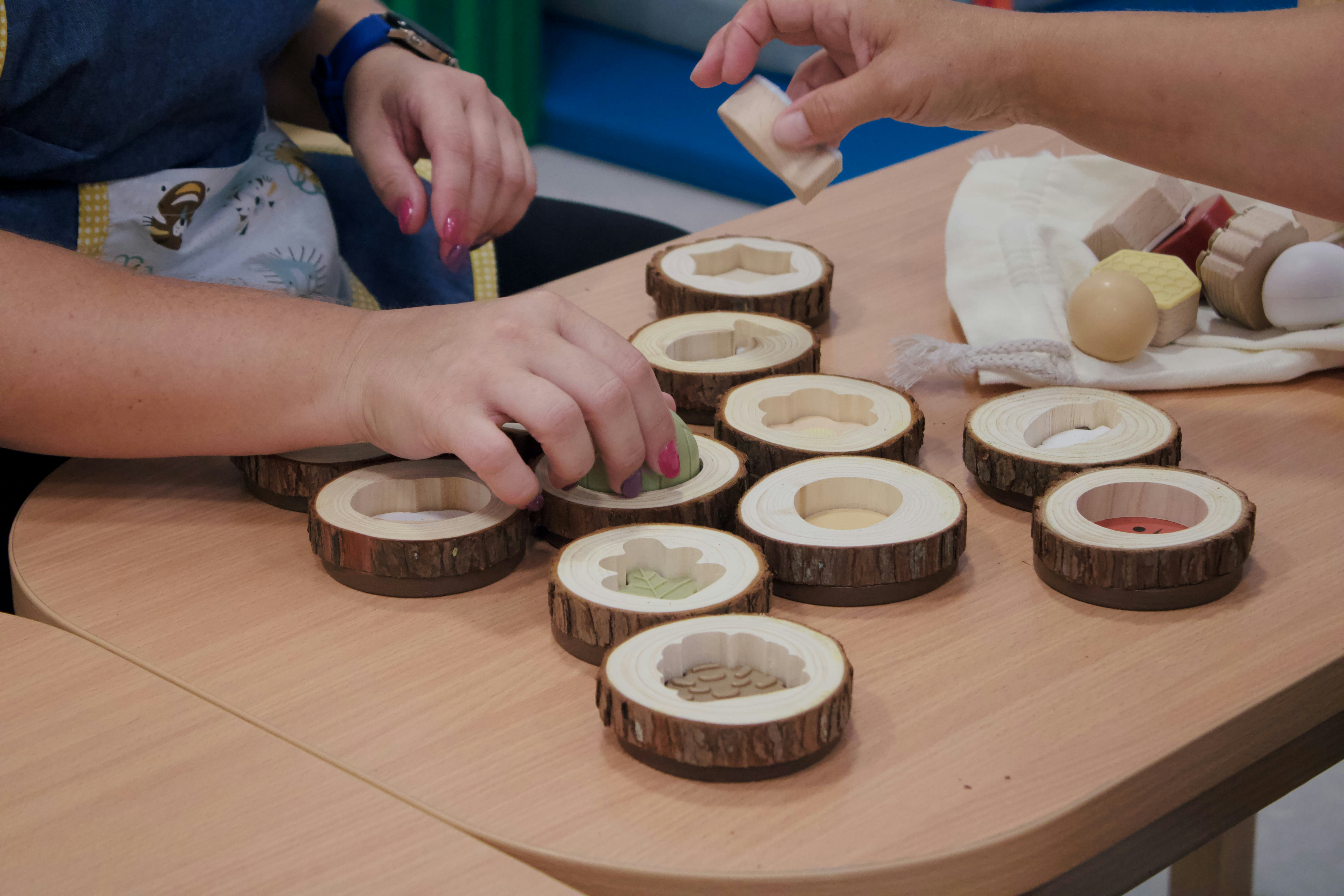 A group of people sitting around a wooden table