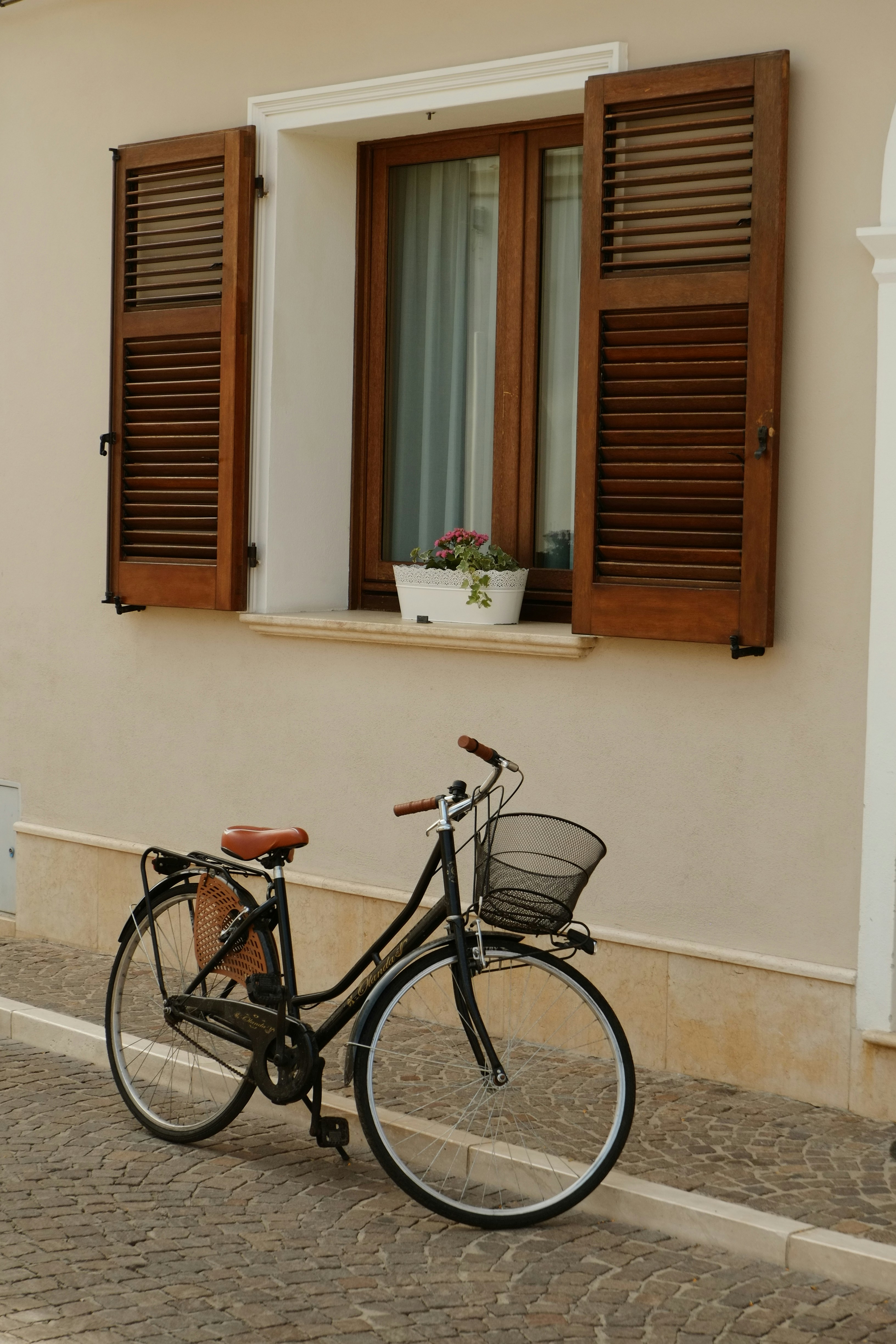 A bicycle parked in front of a building