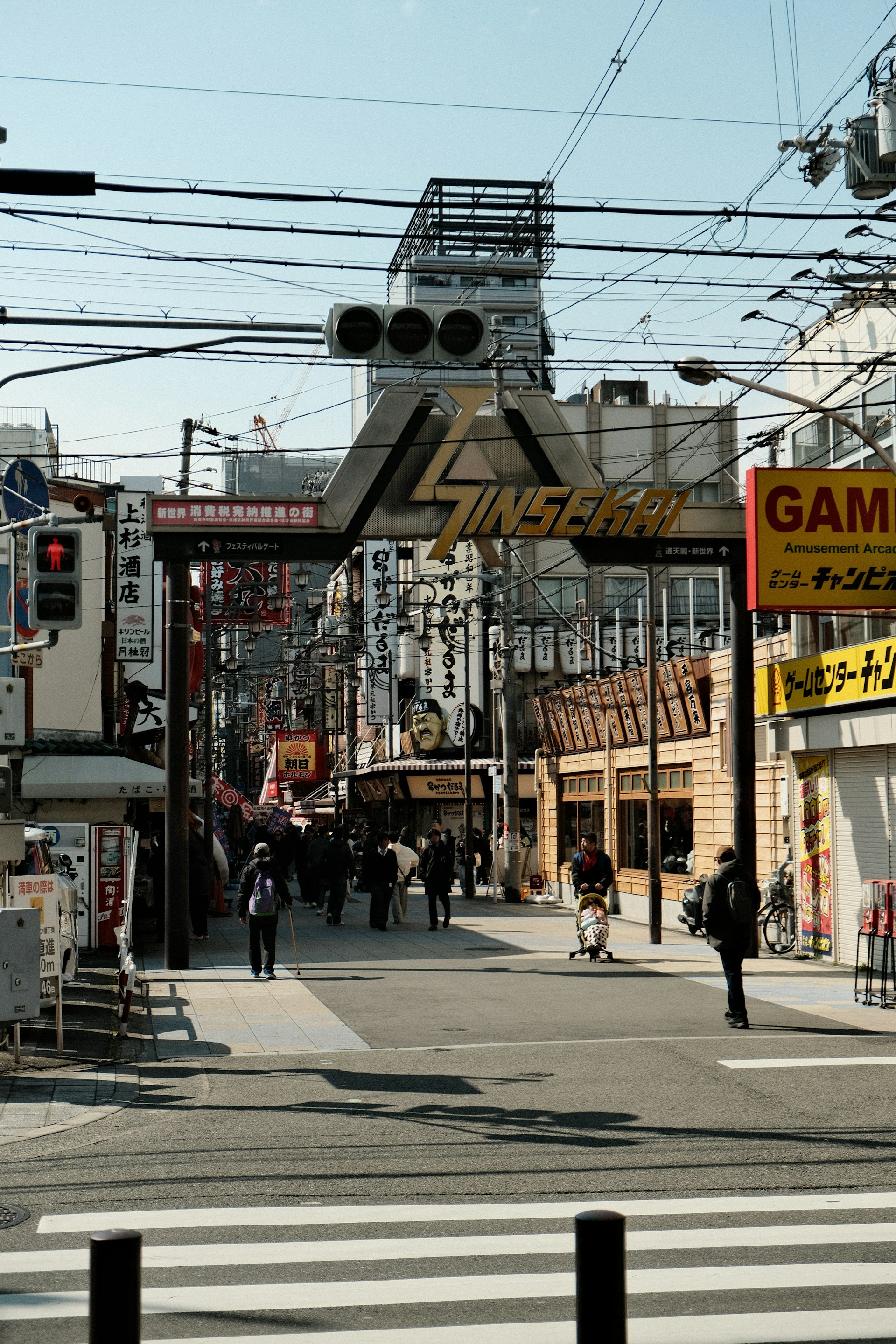 A city street filled with lots of traffic next to tall buildings