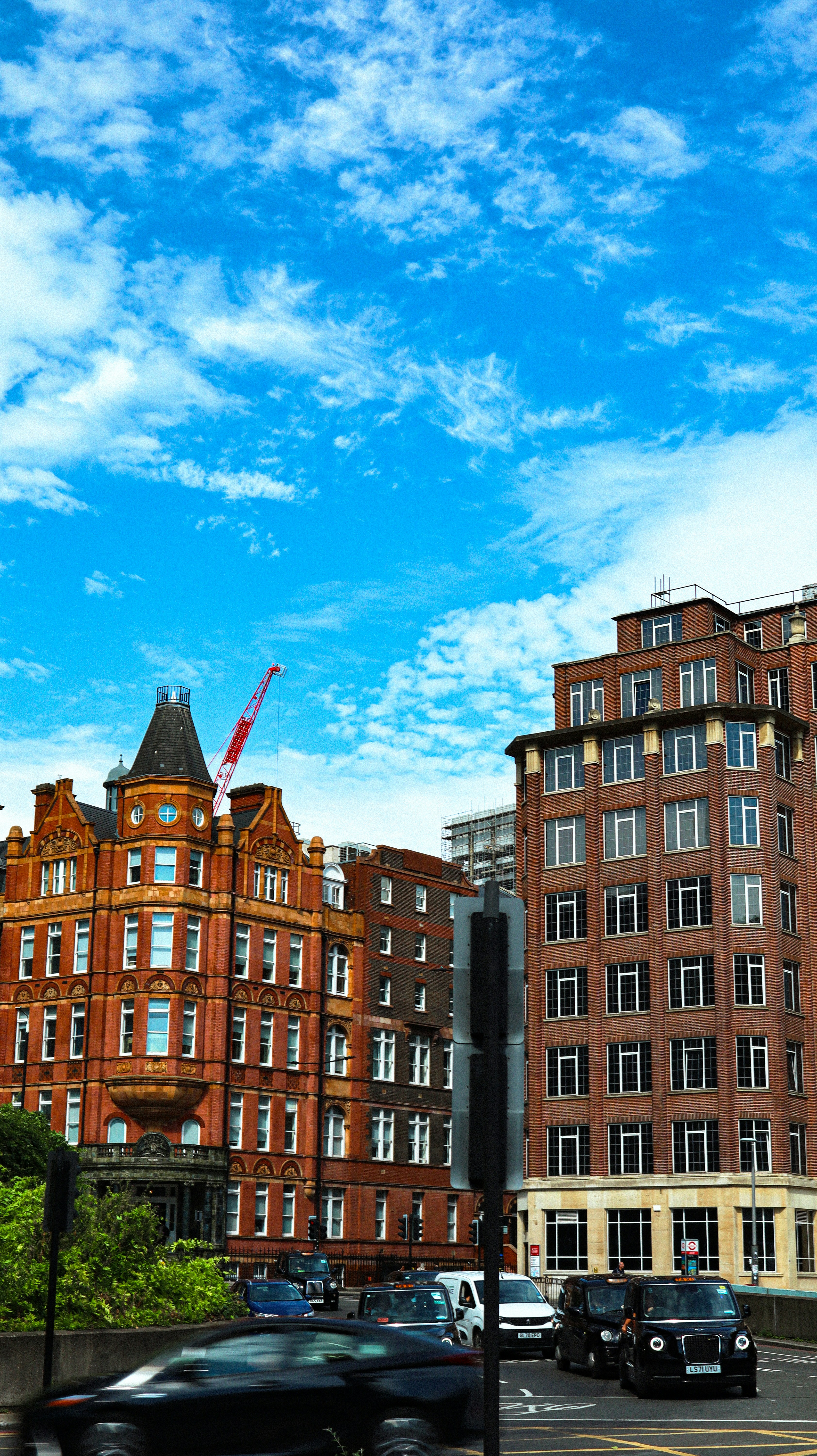A city street filled with lots of tall buildings