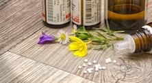 A bottle of medicine sitting on top of a wooden table