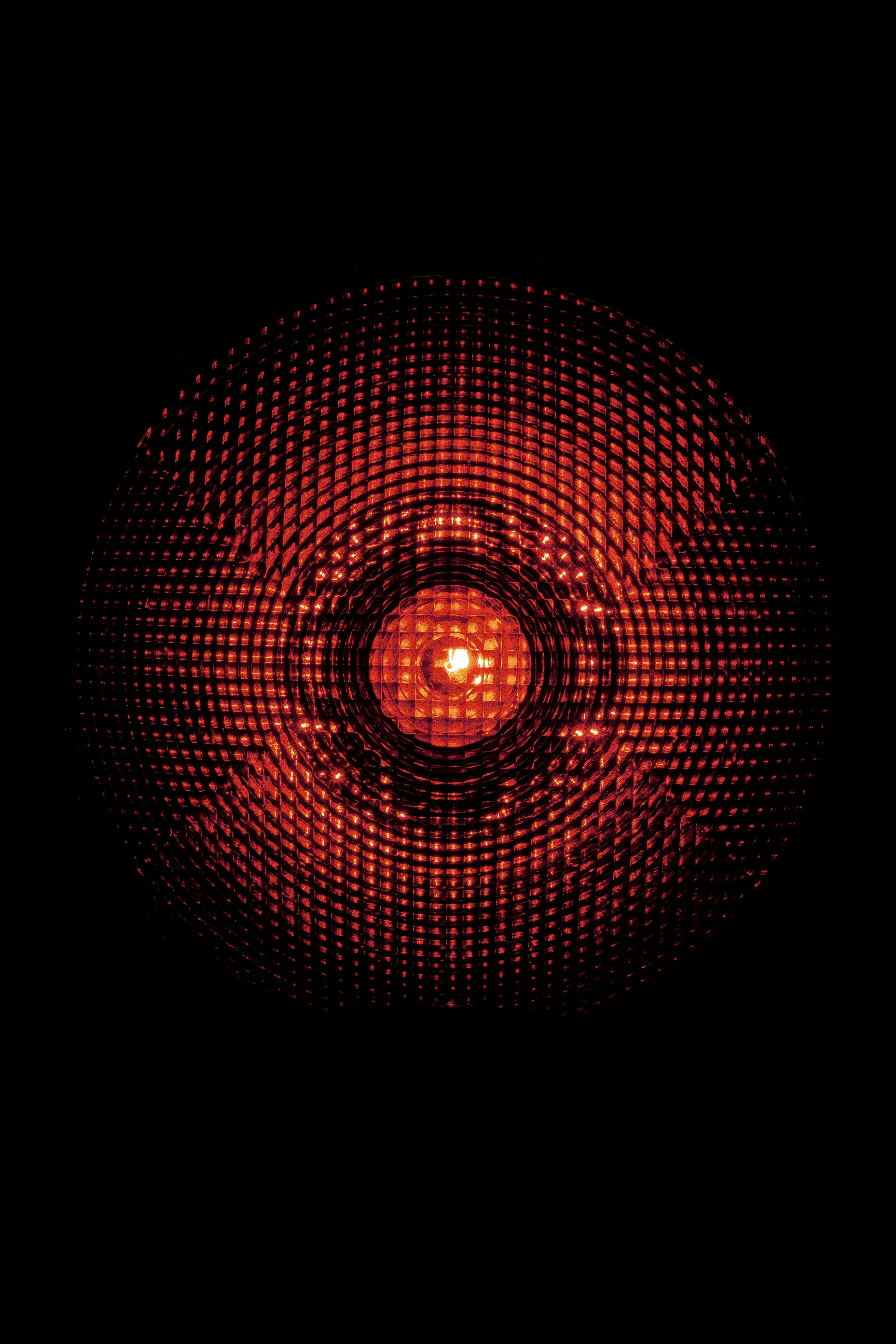 A close up of a red light in the dark