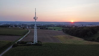 The sun is setting over a rural area