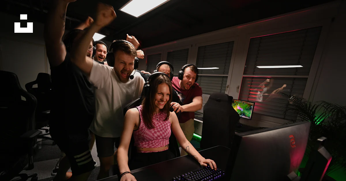 People Standing Using Computer A group of people standing around a computer photo – Free Computer ...