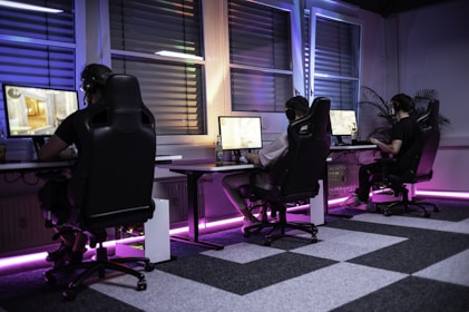 A group of people sitting at computers in a room