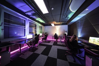 A group of people sitting at desks in a room