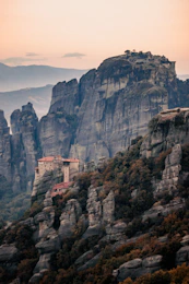 A mountain with a small village on top of it