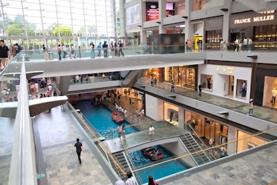 A mall filled with lots of people walking around