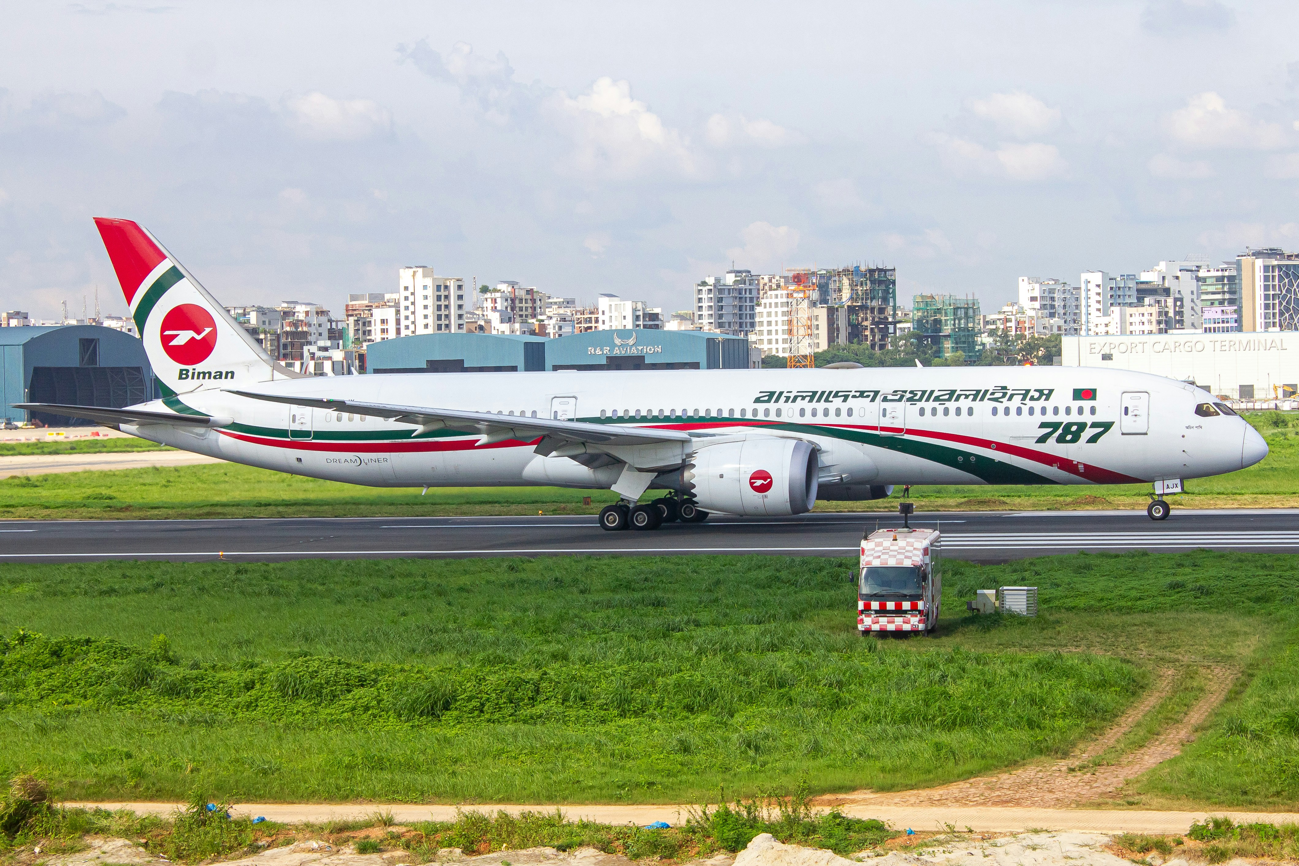A large jetliner sitting on top of an airport runway, Awchin Pakhi departing for Dammam (DMM)