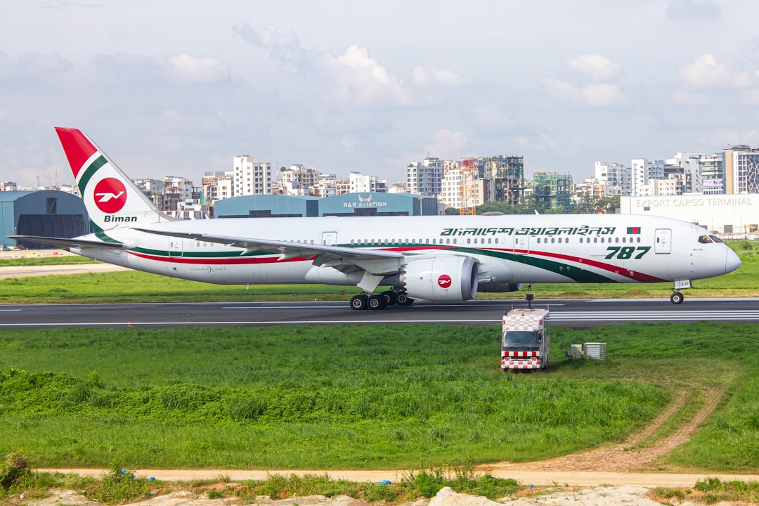 A large jetliner sitting on top of an airport runway, Awchin Pakhi departing for Dammam (DMM)