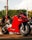 A red motorcycle parked on the side of the road