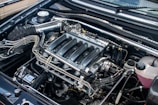 The engine compartment of a car with the hood up