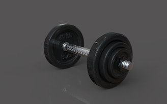 A pair of dumbbells sitting on top of a table