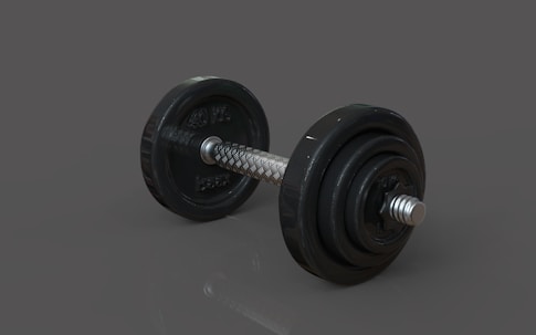 A pair of dumbbells sitting on top of a table