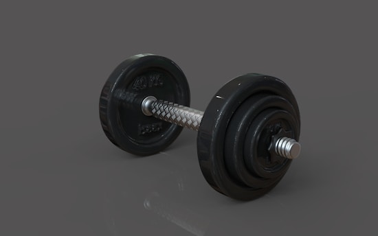 A pair of dumbbells sitting on top of a table