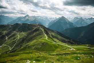 A scenic view of a mountain with a winding road