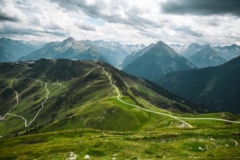 A scenic view of a mountain with a winding road