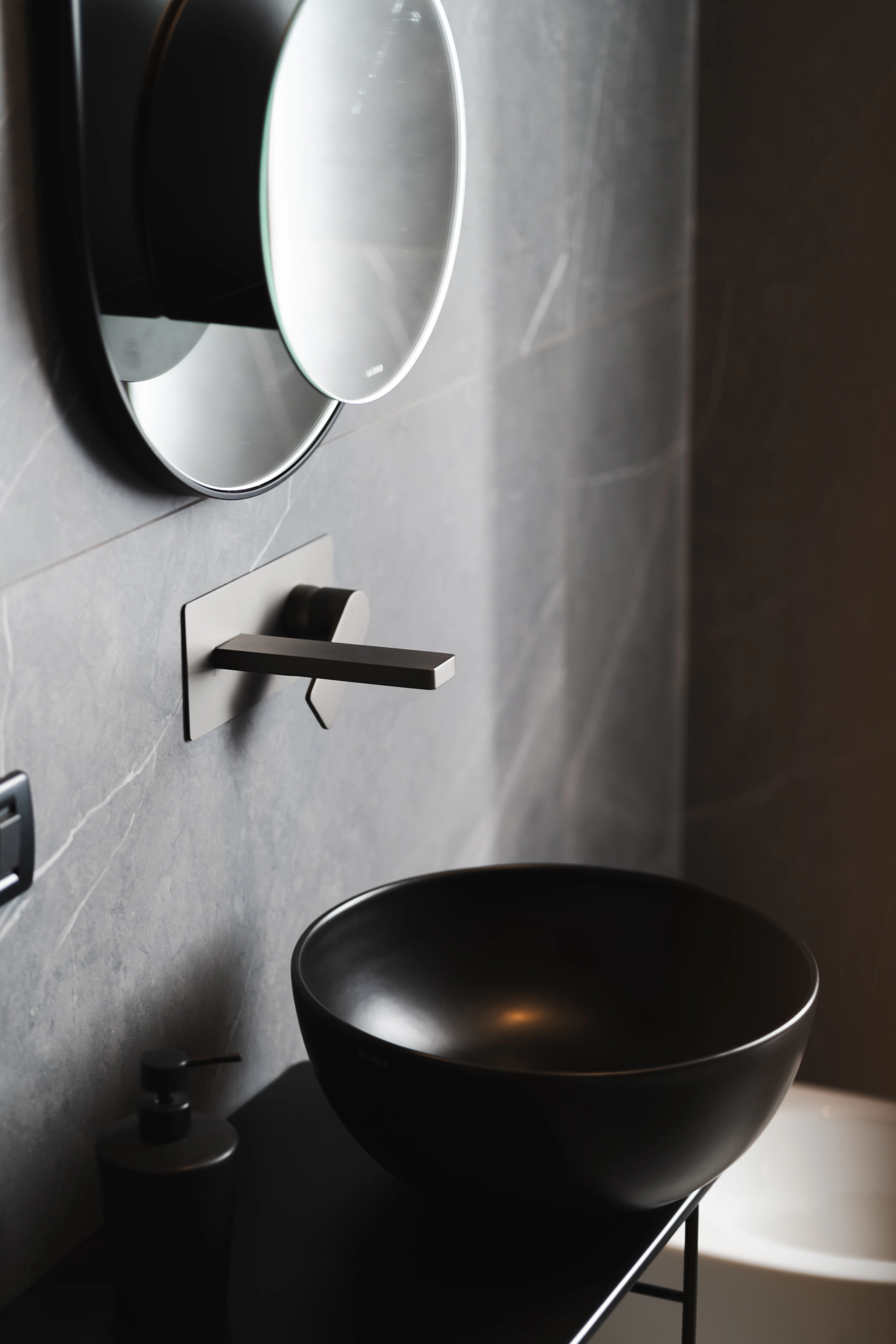 Black lever handle on stone