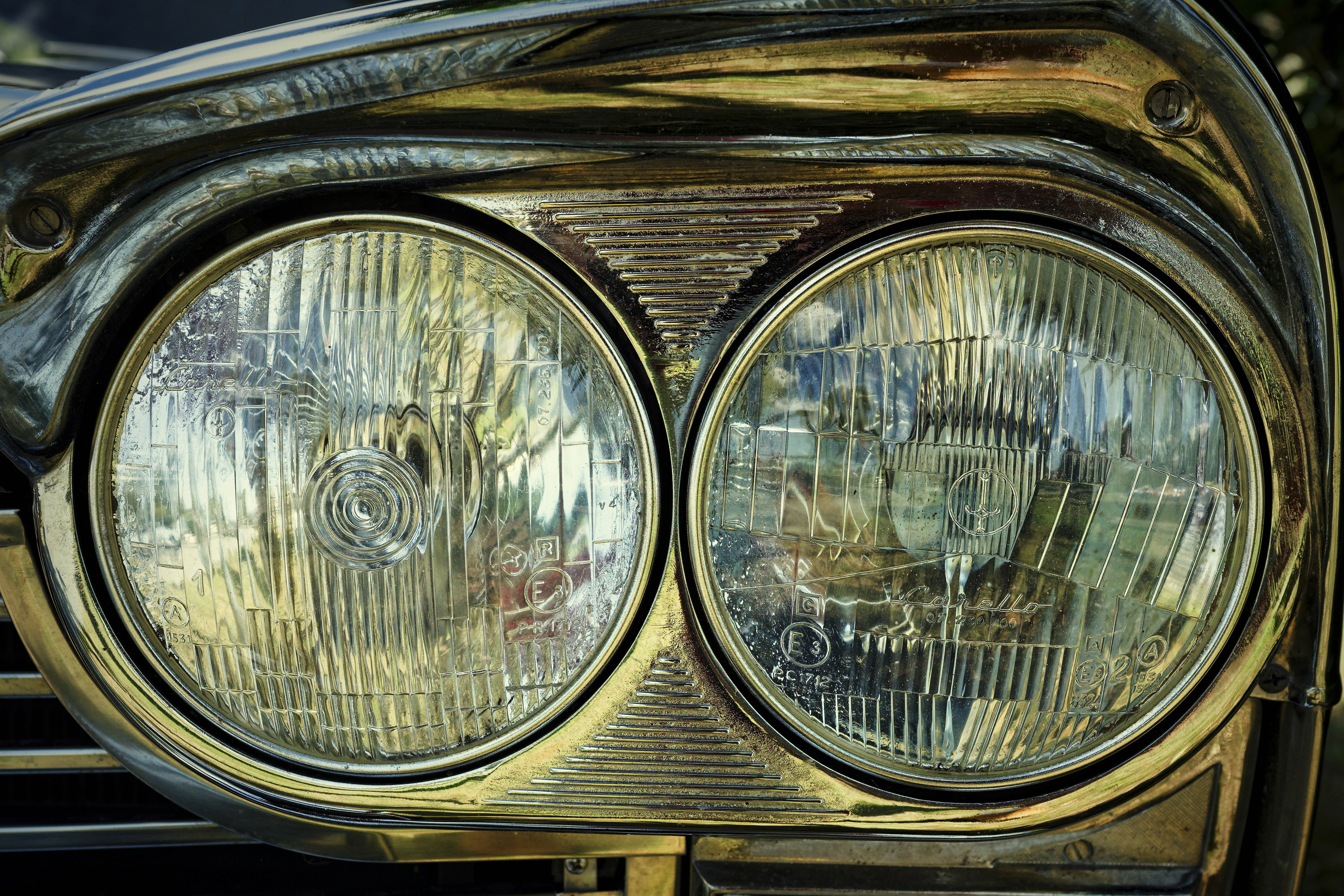 A close up of the headlights of a car
