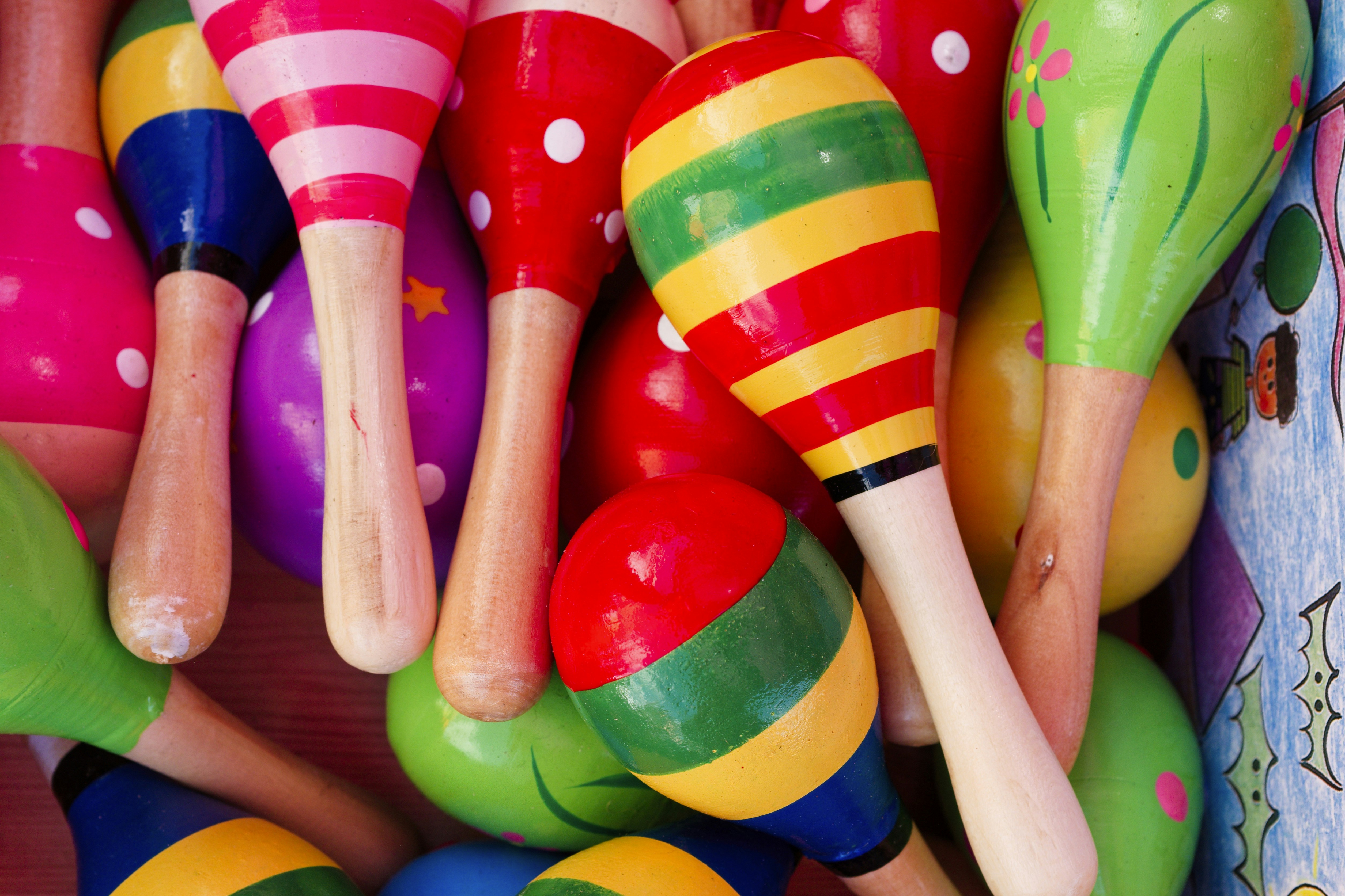 A close up of many colorful wooden toys