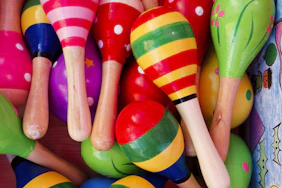 A close up of many colorful wooden toys