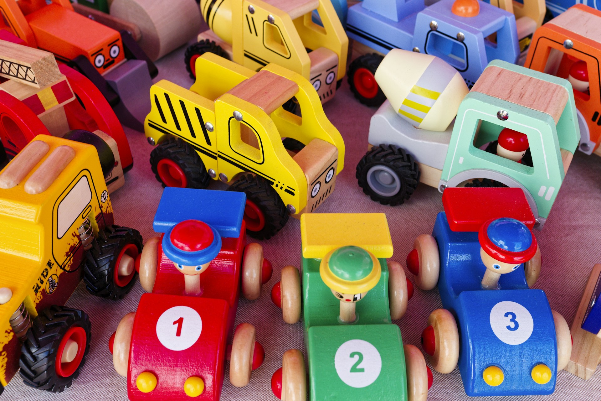 A pile of toy cars sitting on top of a table