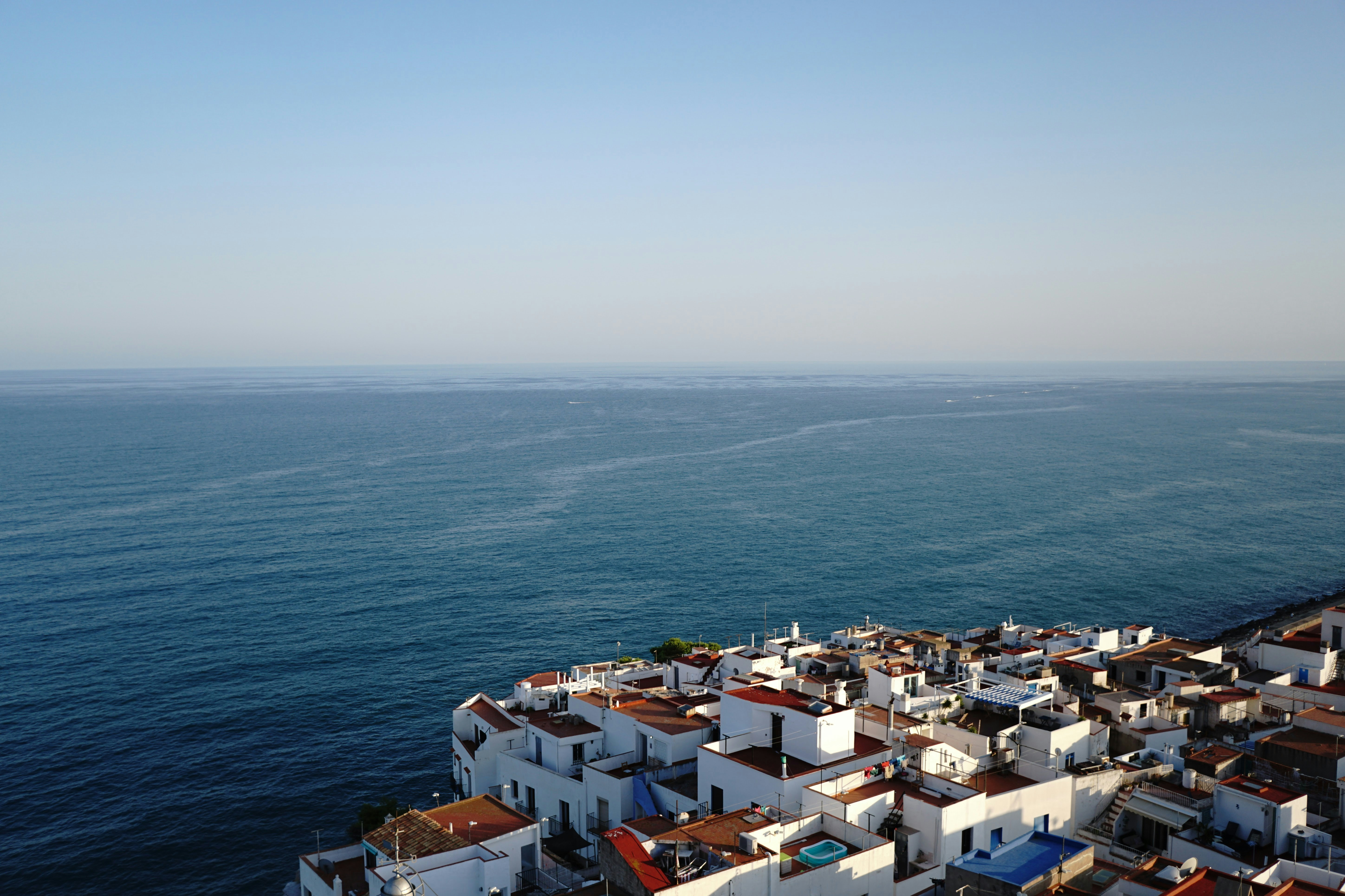 An aerial view of a city by the ocean