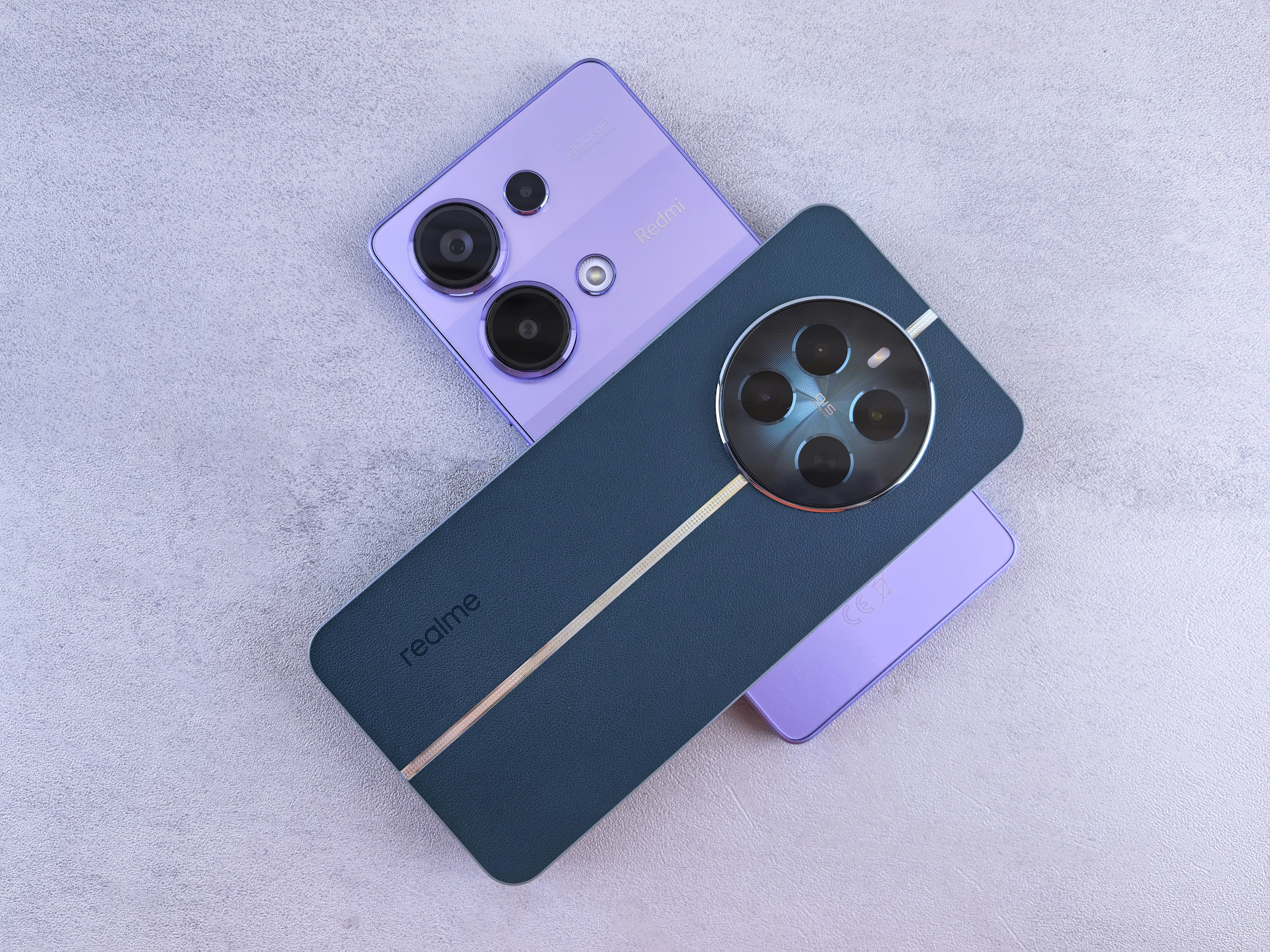 A couple of cell phones sitting next to each other